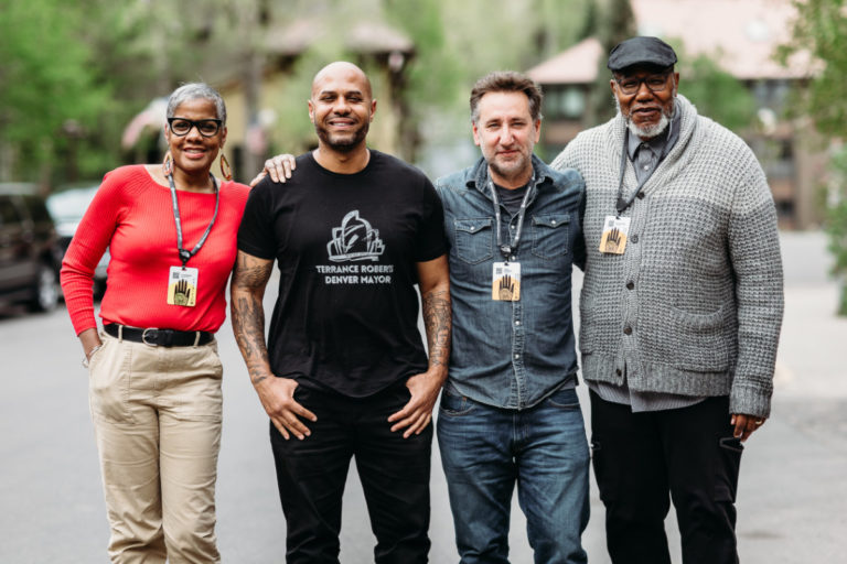 Photo showing Executive Producer Lana Garland, main subject and activist Terrance Roberts, Director Julian Rubinstein, Producer donnie l. betts, in Telluride following a panel.